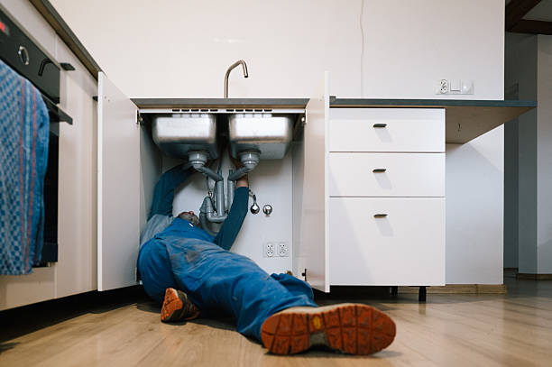 Professional Emergency Plumber technician working in Royal Center, IN